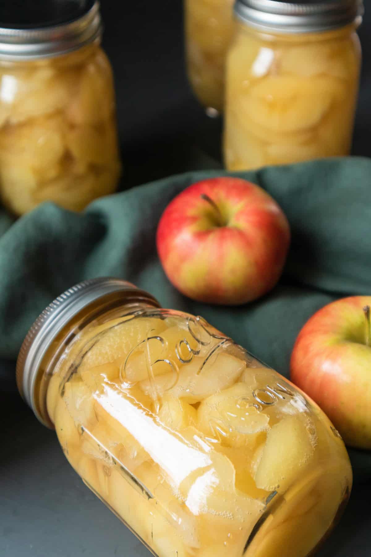 A mason jar of canned apple slices